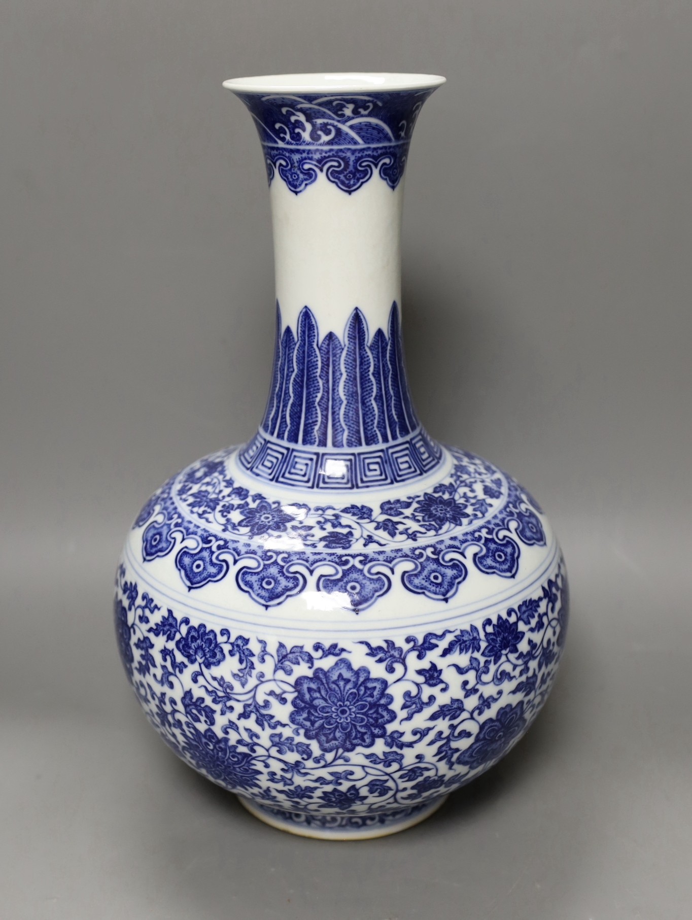 A Chinese blue and white bottle vase, Qianlong seal mark, 37cms high